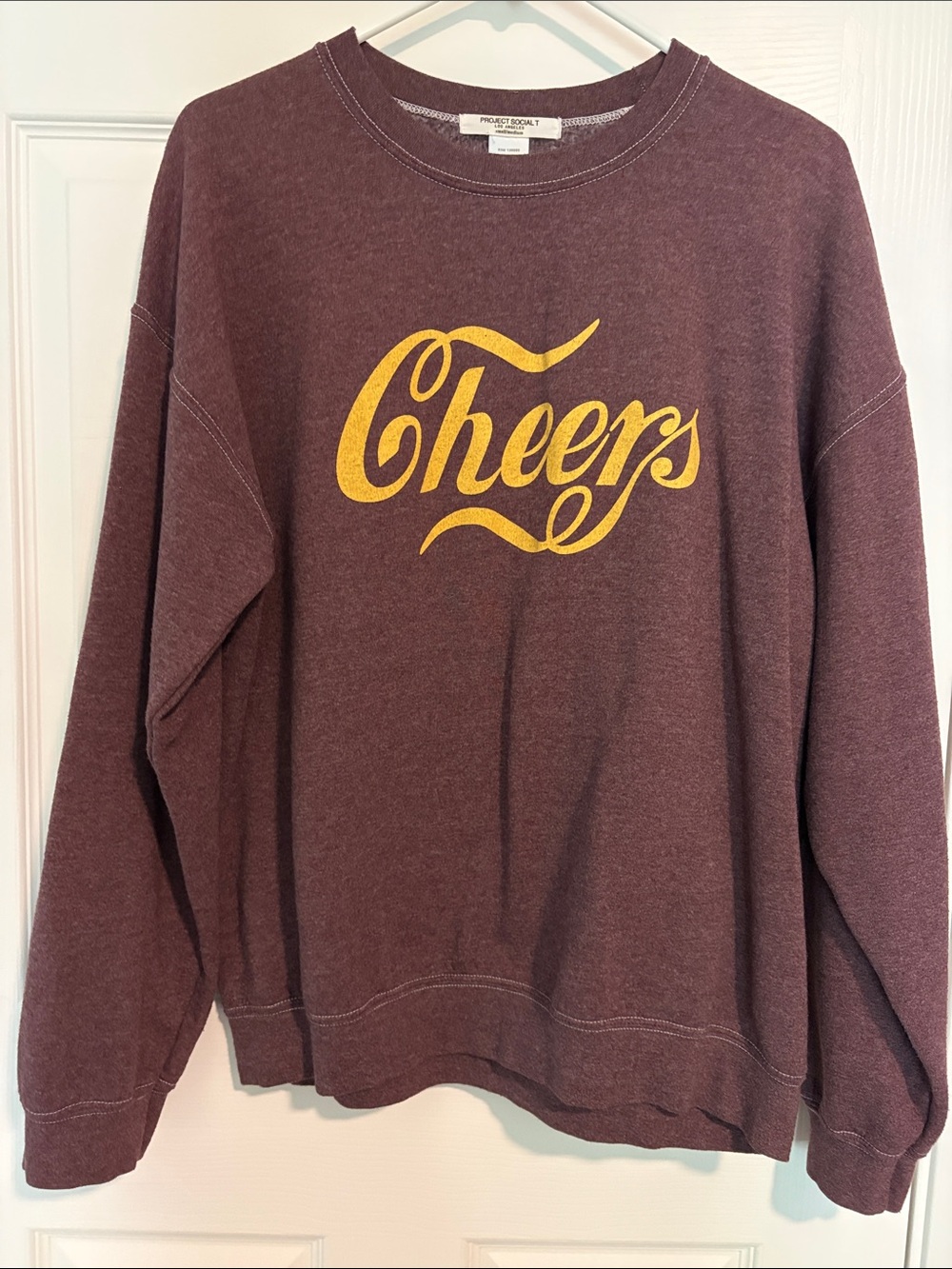 Project Social T Maroon Crewneck Sweatshirt with Yellow "Cheers" Graphic